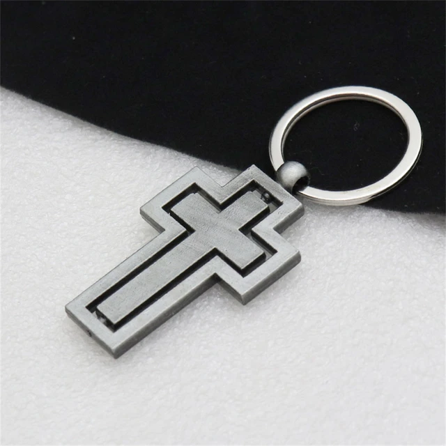 Metal keychain with a rotating cross