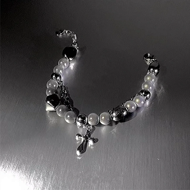 Reflective bracelet with a cross