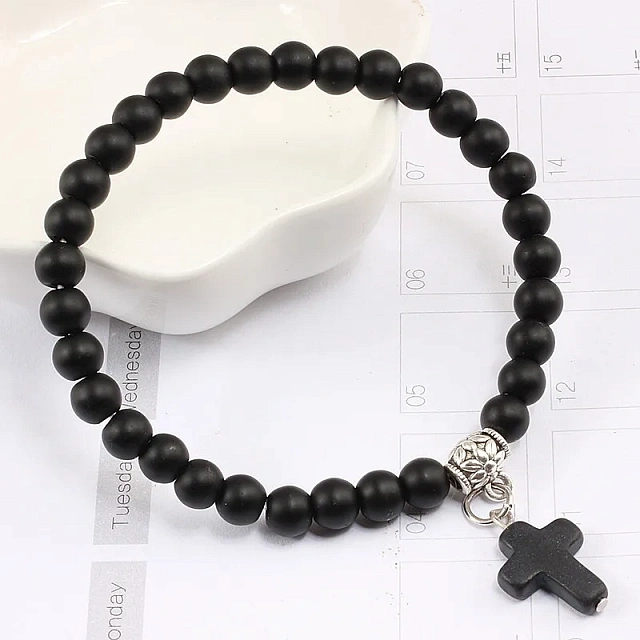 Bracelet made of natural black stone with a cross