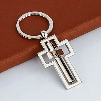 Metal keychain with a rotating cross