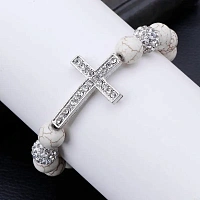 A white stone bracelet with a cross